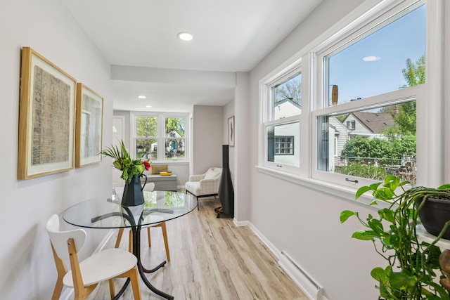 sunroom featuring baseboard heating
