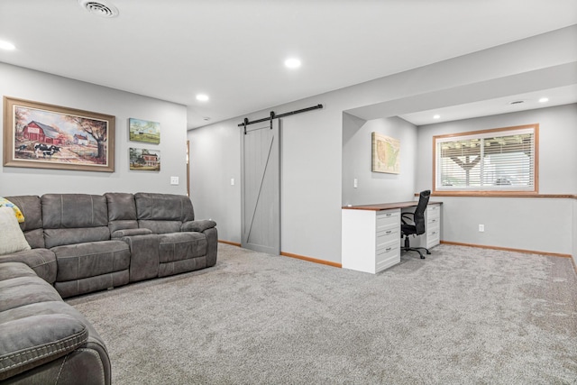 living room featuring a barn door, carpet flooring, recessed lighting, an office area, and baseboards