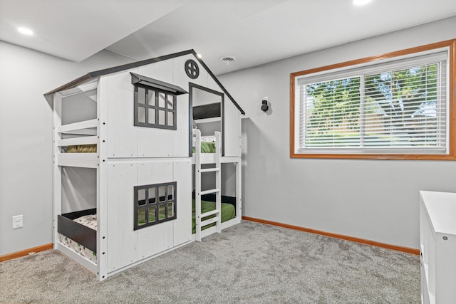 interior space featuring carpet floors, baseboards, and recessed lighting