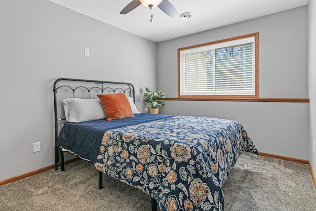 bedroom with carpet floors, baseboards, and a ceiling fan