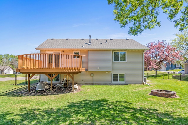 back of house featuring an outdoor fire pit, a deck, roof with shingles, and stairs