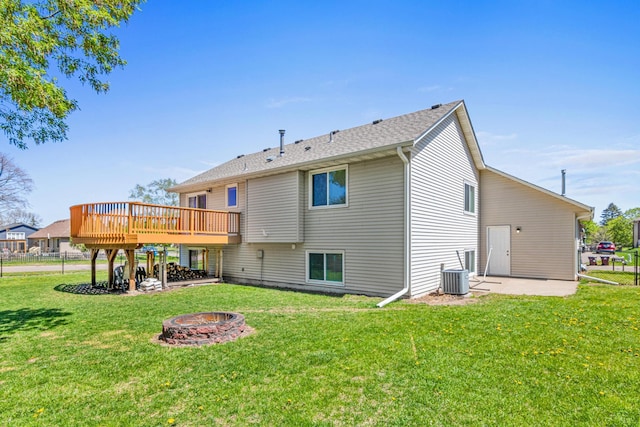 rear view of house featuring an outdoor fire pit, a deck, and a patio