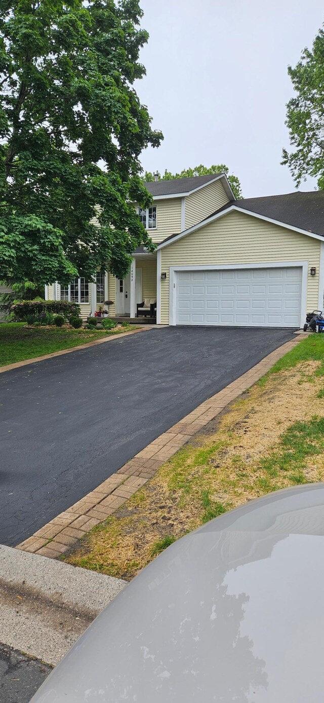 14092 Dearborn Path, Rosemount, MN 55068 - view of front of house with asphalt driveway and an attached garage