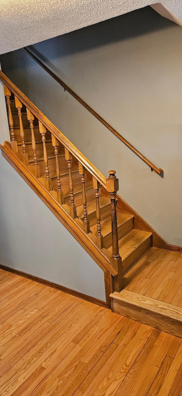 14092 Dearborn Path, Rosemount, MN 55068 - stairs with baseboards and wood finished floors