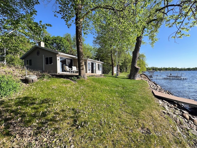 43084 335th Ave, Dora Twp, MN 56528 - view of green lawn featuring a water view and a dock