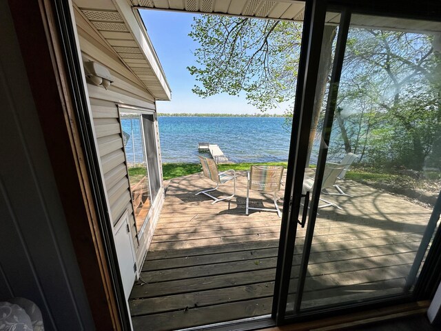 43084 335th Ave, Dora Twp, MN 56528 - wooden terrace with a water view
