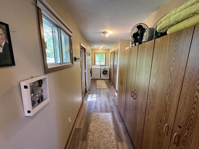 43084 335th Ave, Dora Twp, MN 56528 - corridor with independent washer and dryer, a textured ceiling, and wood finished floors