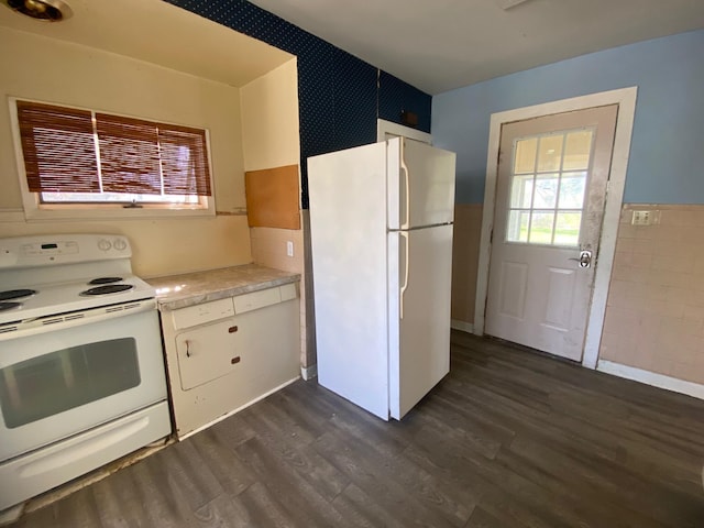 kitchen featuring white appliances, tile walls, dark wood-style flooring, light countertops, and white cabinets