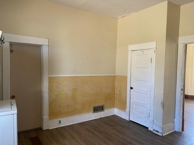 402 Main St, Mahnomen, MN 56557 - spare room with wood finished floors and a textured ceiling