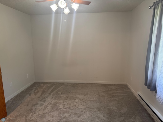 316 4th S, Breckenridge, MN 56520 - carpeted empty room with baseboard heating, a ceiling fan, and baseboards