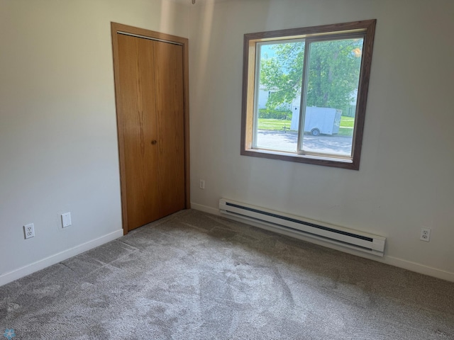 316 4th S, Breckenridge, MN 56520 - unfurnished bedroom with a baseboard radiator, carpet, and baseboards