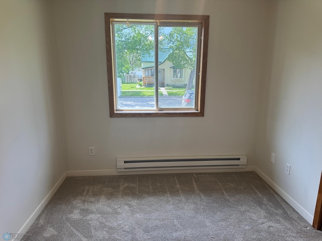316 4th S, Breckenridge, MN 56520 - empty room with carpet flooring, a baseboard radiator, and baseboards