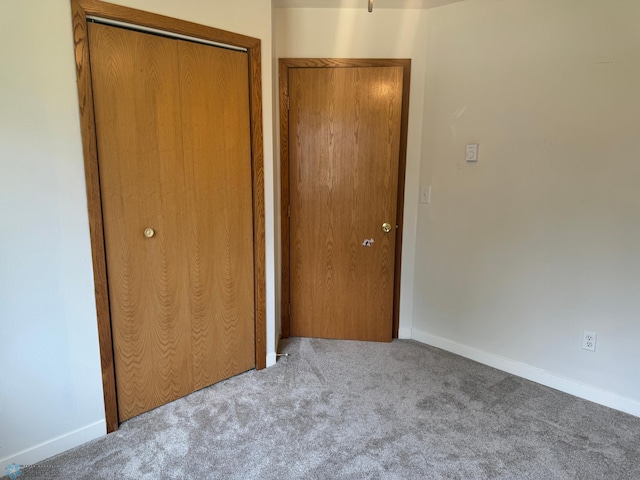 316 4th S, Breckenridge, MN 56520 - unfurnished bedroom with carpet, baseboards, and a closet