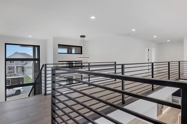 1796 Cobblestone Ct, Hastings, MN 55033 - hall with an upstairs landing, wood finished floors, and recessed lighting