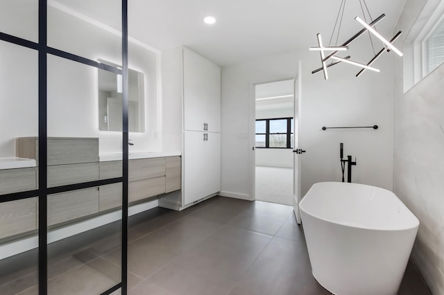 1796 Cobblestone Ct, Hastings, MN 55033 - full bathroom featuring vanity, a soaking tub, and tile patterned floors
