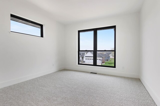 1796 Cobblestone Ct, Hastings, MN 55033 - spare room with light colored carpet, healthy amount of natural light, and baseboards