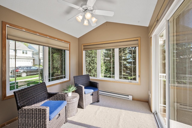 sunroom / solarium featuring a baseboard radiator, healthy amount of natural light, and vaulted ceiling