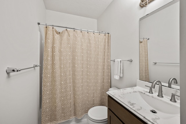 full bathroom with toilet, vanity, and curtained shower
