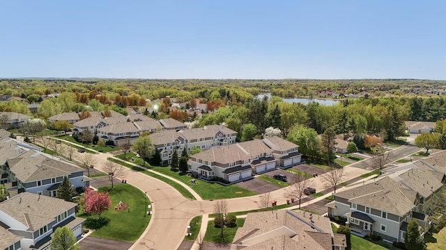 aerial view of residential area featuring a nearby body of water