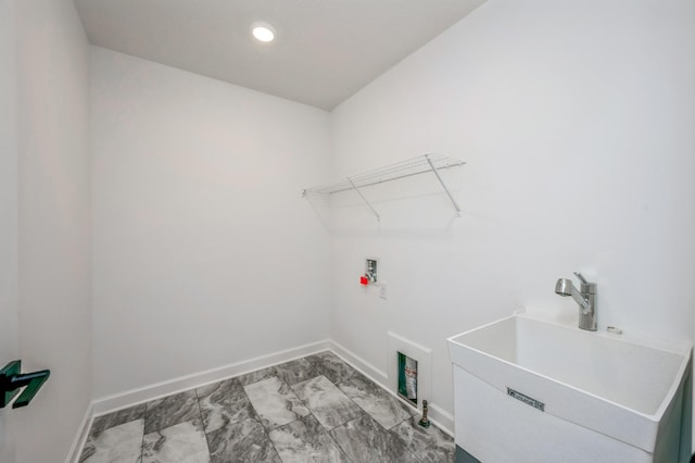 laundry room with marble look tile flooring, washer hookup, baseboards, and recessed lighting