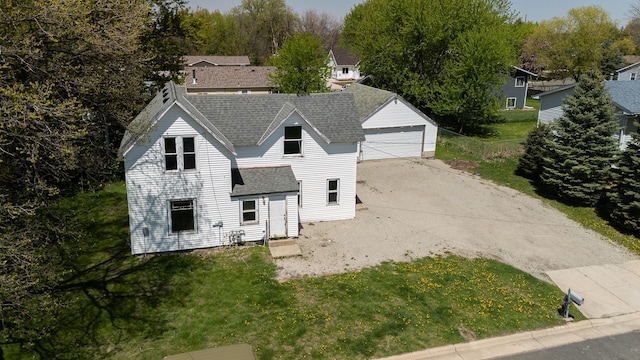 812 Main St, Dodge Center, MN 55927 - view of front of home featuring roof with shingles, a garage, and a front yard