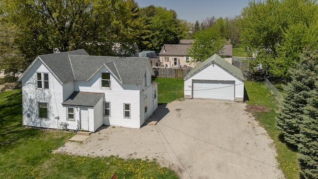 812 Main St, Dodge Center, MN 55927 - view of front facade featuring roof with shingles, an outdoor structure, and a garage