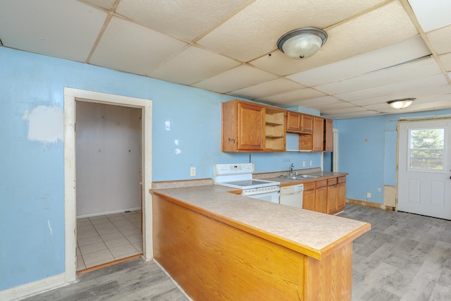 812 Main St, Dodge Center, MN 55927 - kitchen featuring white appliances, a paneled ceiling, open shelves, a sink, and light wood-type flooring