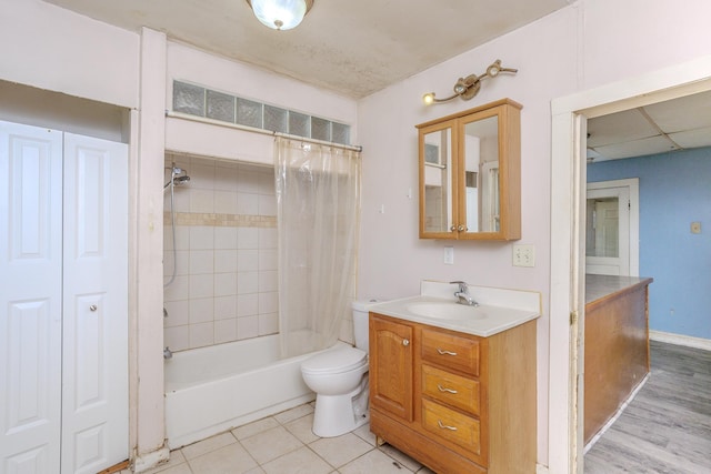 812 Main St, Dodge Center, MN 55927 - full bath with toilet, shower / bath combo, vanity, and tile patterned flooring