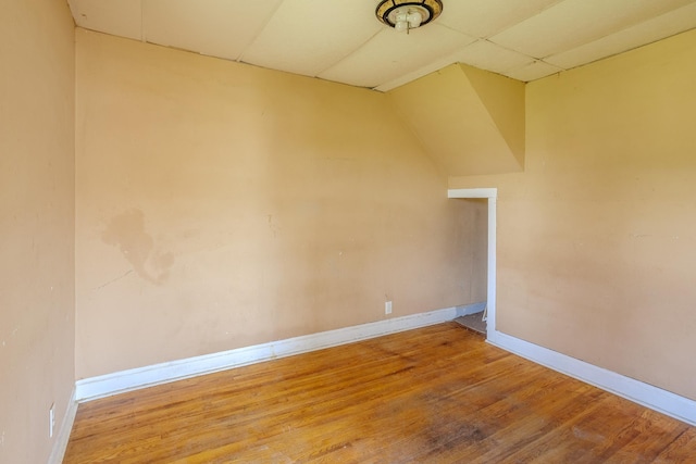 812 Main St, Dodge Center, MN 55927 - unfurnished room with a drop ceiling, baseboards, and wood finished floors