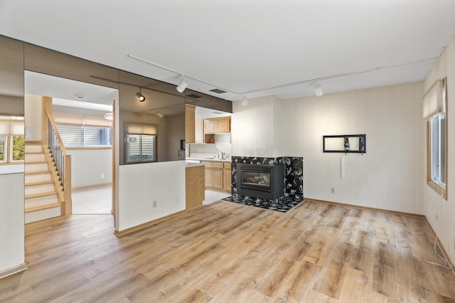 4348 Arden View Ct, Arden Hills, MN 55112 - kitchen with light wood-type flooring, rail lighting, light countertops, baseboards, and a sink