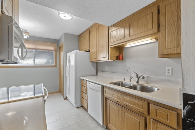 4348 Arden View Ct, Arden Hills, MN 55112 - kitchen featuring white appliances, a sink, light tile patterned floors, a textured ceiling, and brown cabinets