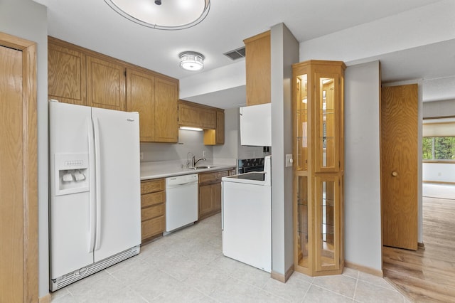 4348 Arden View Ct, Arden Hills, MN 55112 - kitchen featuring white appliances, a sink, light countertops, and brown cabinetry