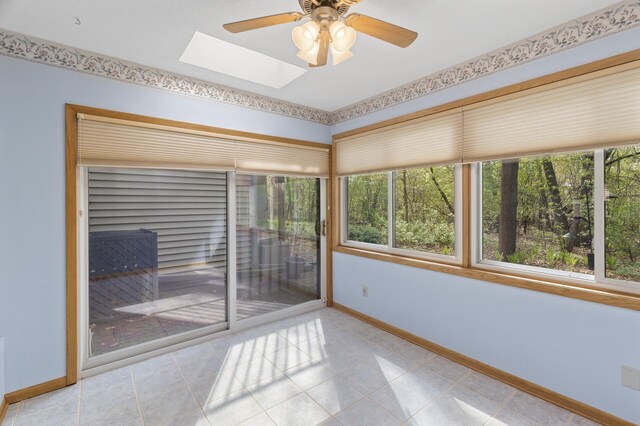 4348 Arden View Ct, Arden Hills, MN 55112 - spare room featuring baseboards, a skylight, ceiling fan, and tile patterned floors