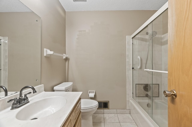 4348 Arden View Ct, Arden Hills, MN 55112 - bathroom featuring toilet, a textured ceiling, tile patterned floors, vanity, and shower / bath combination with glass door