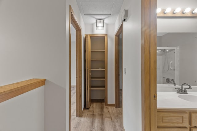4348 Arden View Ct, Arden Hills, MN 55112 - hall with a sink, wood finished floors, and a textured ceiling