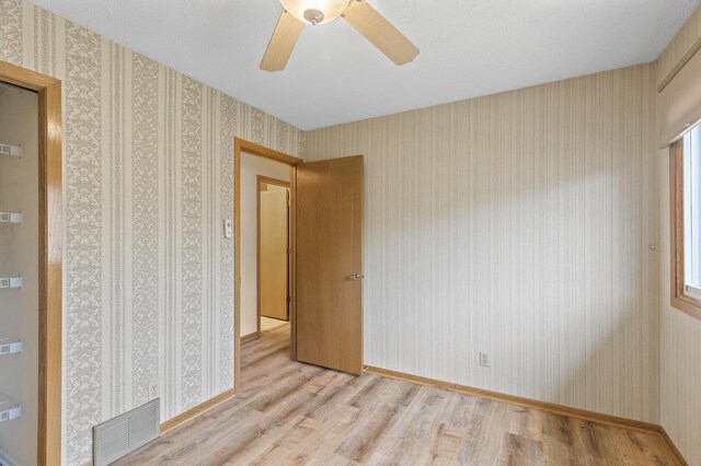 4348 Arden View Ct, Arden Hills, MN 55112 - empty room featuring wood finished floors and a ceiling fan
