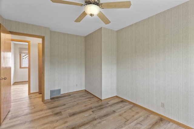 4348 Arden View Ct, Arden Hills, MN 55112 - empty room with wood finished floors, wallpapered walls, baseboards, and a ceiling fan