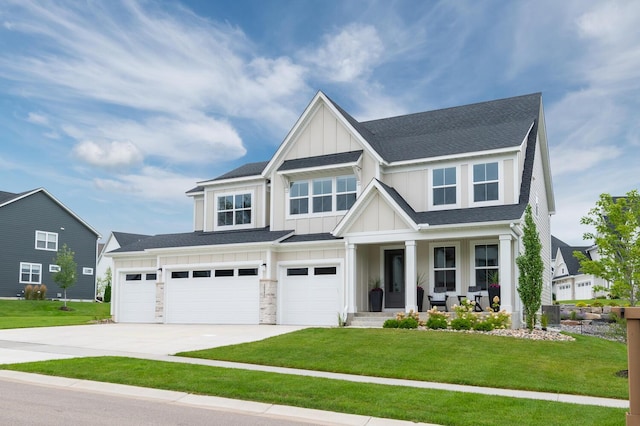 craftsman inspired home featuring board and batten siding, covered porch, driveway, an attached garage, and a front yard