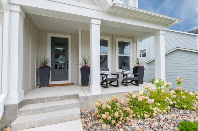 entrance to property featuring a porch