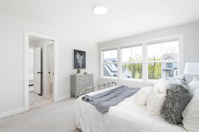 carpeted bedroom with baseboards