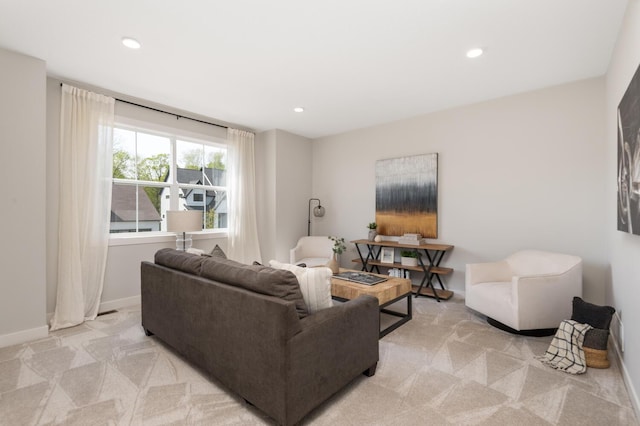 living room with light carpet, recessed lighting, and baseboards
