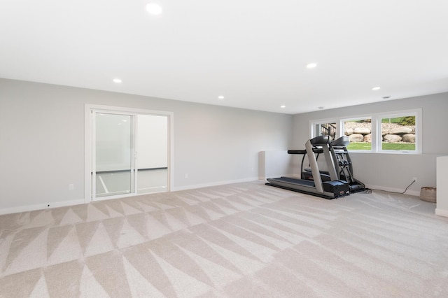 workout room featuring light colored carpet, recessed lighting, and baseboards
