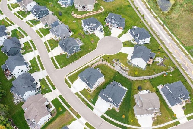 aerial view of property and surrounding area with nearby suburban area