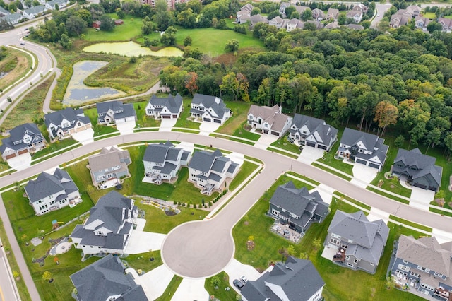 view of property location with nearby suburban area and a large body of water