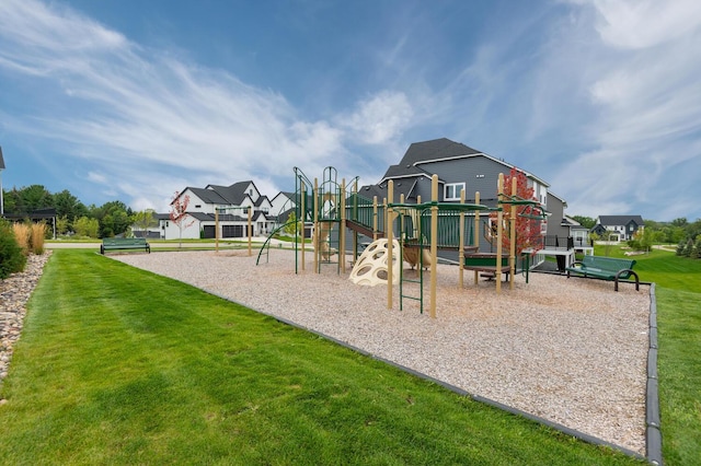 community play area with a yard and a residential view