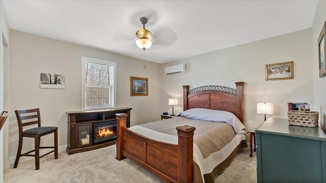 65770 Big Pine Rd, Finlayson, MN 55735 - bedroom with a wall mounted air conditioner, light colored carpet, a glass covered fireplace, and a ceiling fan