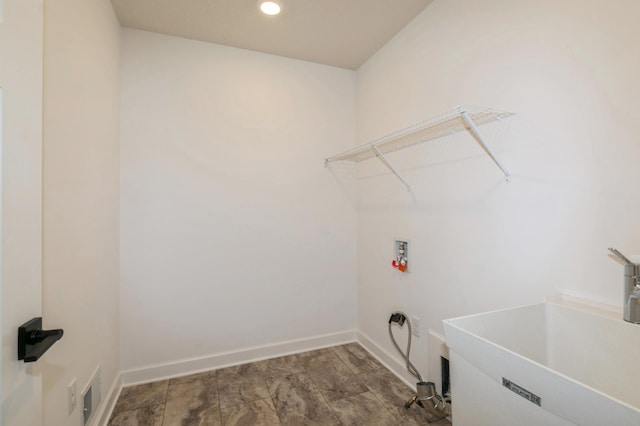 laundry room with washer hookup, baseboards, and recessed lighting