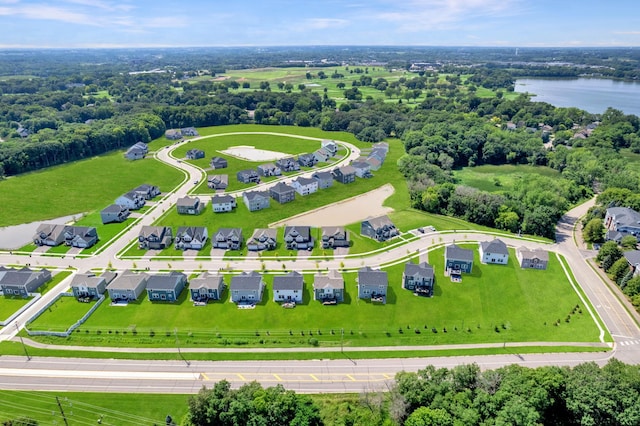 birds eye view of property featuring a water view and a residential view