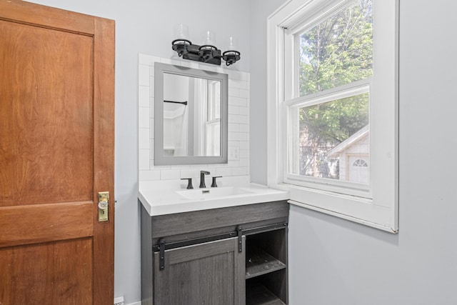 604 Asbury St, Saint Paul, MN 55104 - bathroom featuring vanity and tasteful backsplash