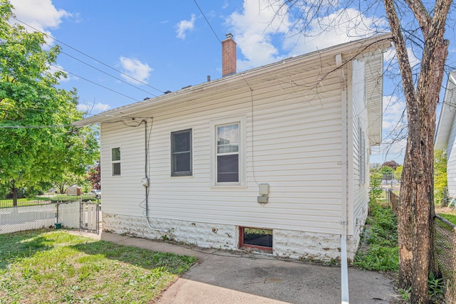 604 Asbury St, Saint Paul, MN 55104 - view of property exterior featuring fence and a chimney